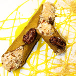 Celebrate the season with the ultimate holiday treat – our Eggnog Pecan Cannoli. This decadent dessert combines the classic Italian cannoli with the warm, comforting flavours of eggnog, making it the perfect festive dessert! The crispy, delicate shell is generously filled with a rich, creamy eggnog-flavoured filling, blended with a hint of nutmeg and cinnamon to evoke the cozy essence of the holiday season.&nbsp; Trimming the ends are crushed pecans and a caramel pecan is poised on top!

