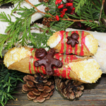 It’s the time of the year to bake, bake and bake!  We have created gingerbread cannoli for the Holiday Season. Our creamy, smooth ricotta is infused with nutmeg, cloves, and all things gingerbread!  Our crispy, crunchy shell is drizzled with our in-house red and green sugar icing and then finished off with a hand painted and house-made marzipan gingerbread.  Let us do the baking for you!