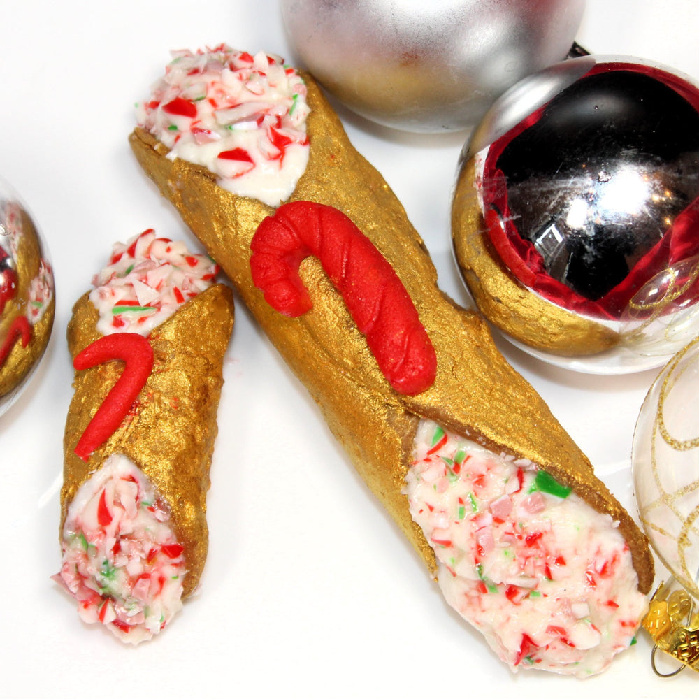 Candy canes were first created to keep the little kids happy and quiet during Christmas Eve Mass 1670 AD in the Cathedrals in Cologne. Mixing the peppermint flavour into our creamy, smooth ricotta, dipping the ends in crushed candy cane, and decorating the crispy, crunchy pastry shell in silver with a house-made marzipan candy cane on top shows our love for tradition with a twist!